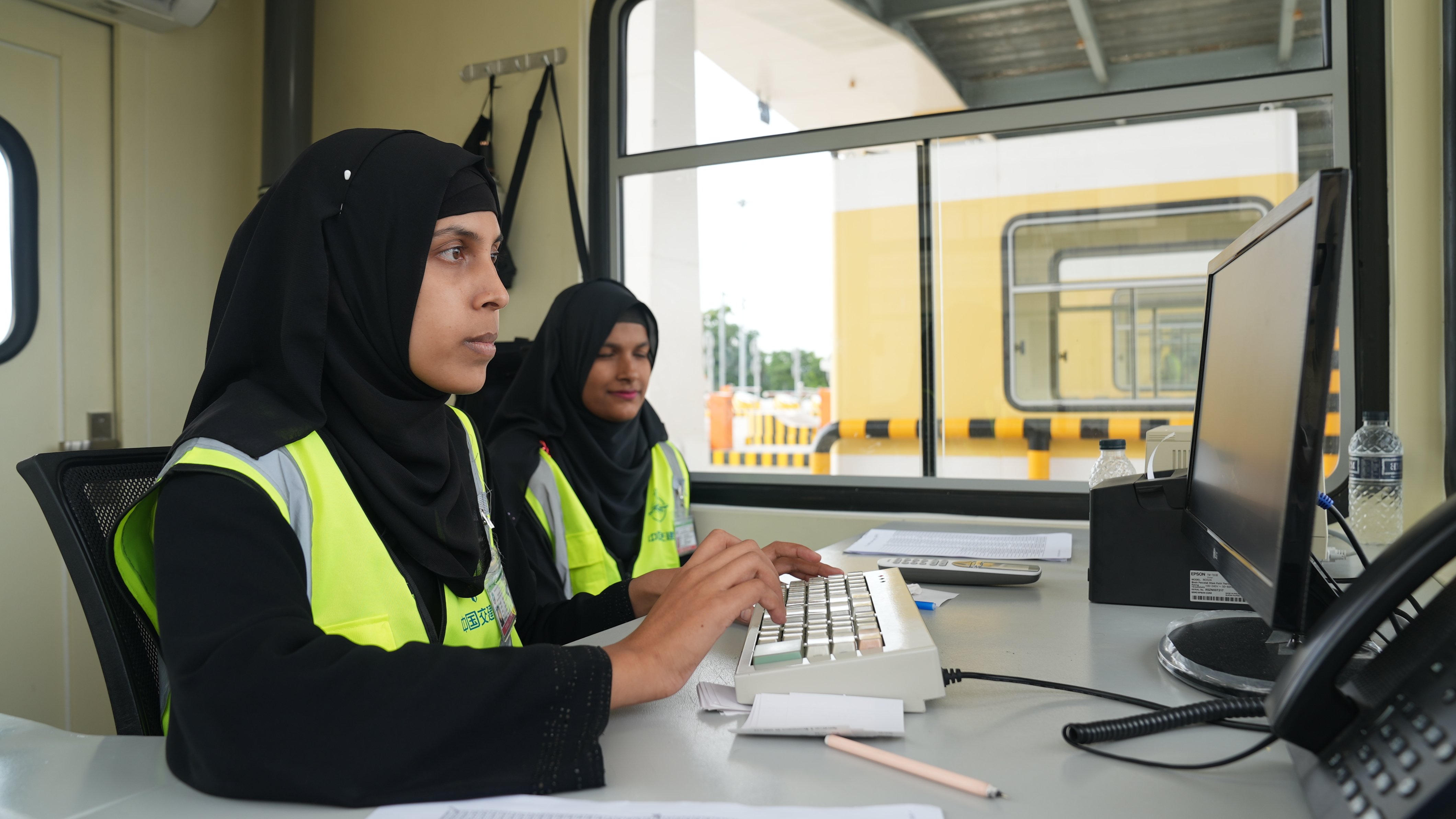 Staff work at a checkpoint at the Karnaphuli Tunnel in Chittagong, Bangladesh. /CGTN
