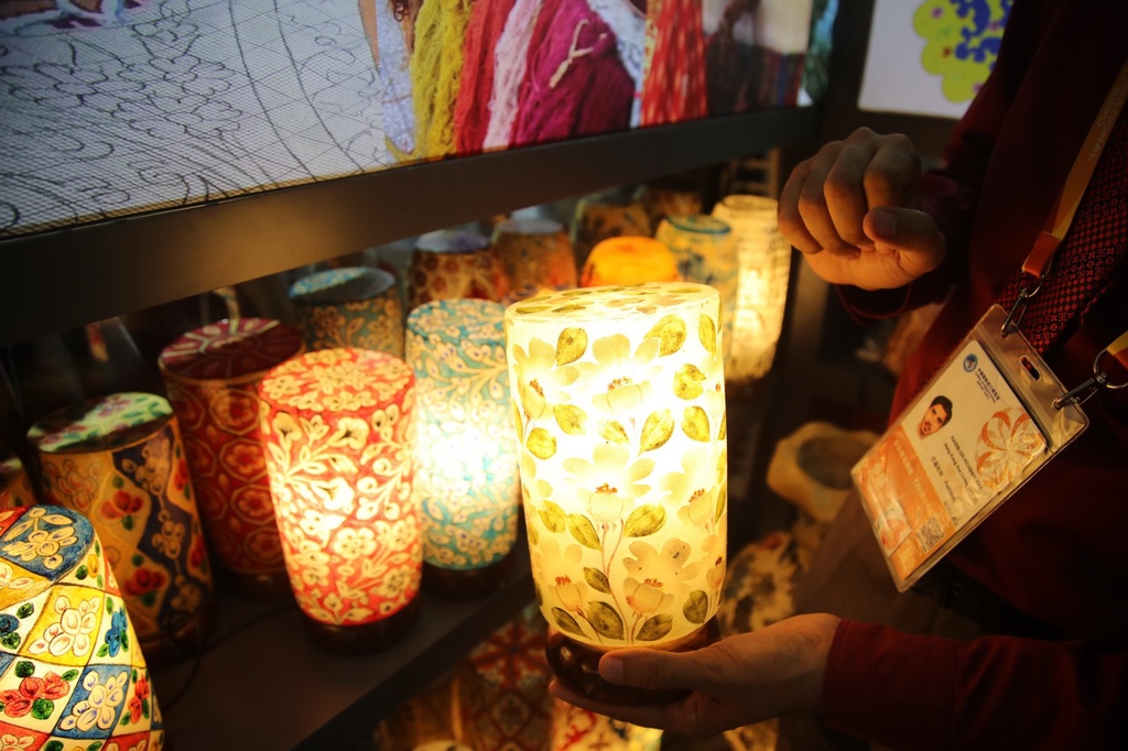 A photo taken on November 5, 2023, shows camel skin lamps exhibited at the China International Import Expo in Shanghai. /IC
