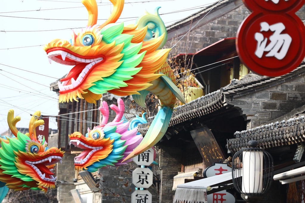 A photo shows dragon lantern decorations strung up in an alleyway in the Qinhuai District of Nanjing, Jiangsu on December 13, 2023. /IC