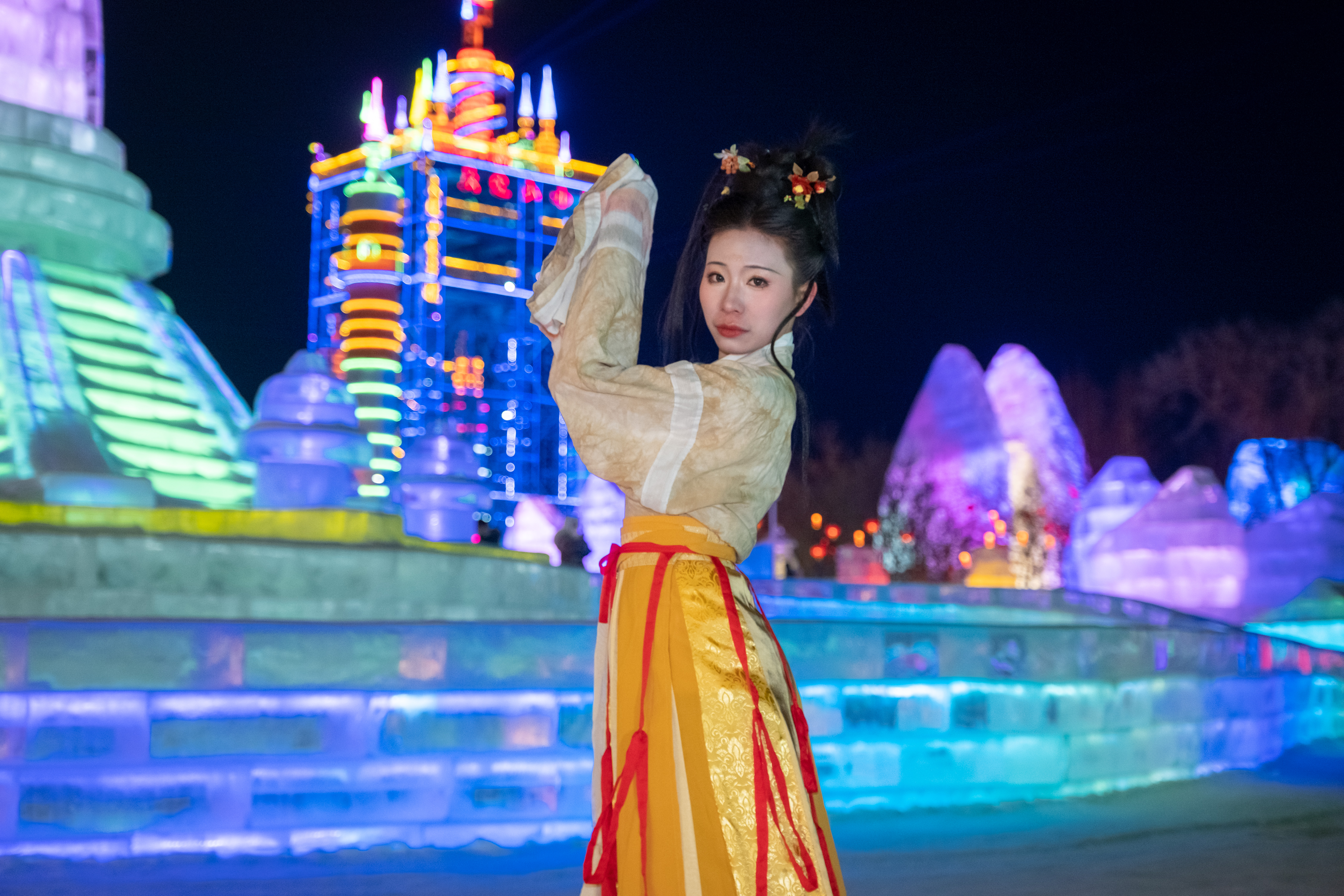 A woman dressed in traditional hanfu attire poses for a photo at Changchun Ice and Snow New World in northeast China's Jilin Province, on January 9, 2024. /IC