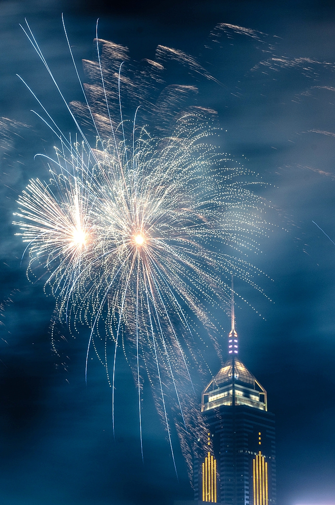 Chinese New Year fireworks light up the sky over Victoria Harbor in Hong Kong, February 11, 2024. /CFP