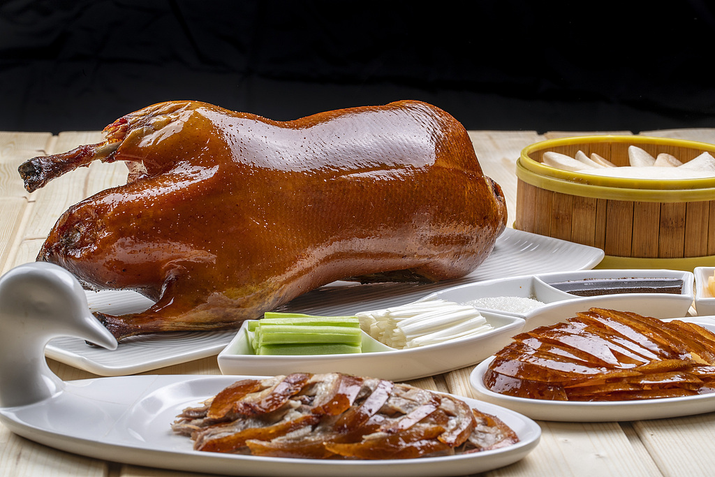 Peking duck served with pancakes, scallions and sweet bean sauce. /VCG