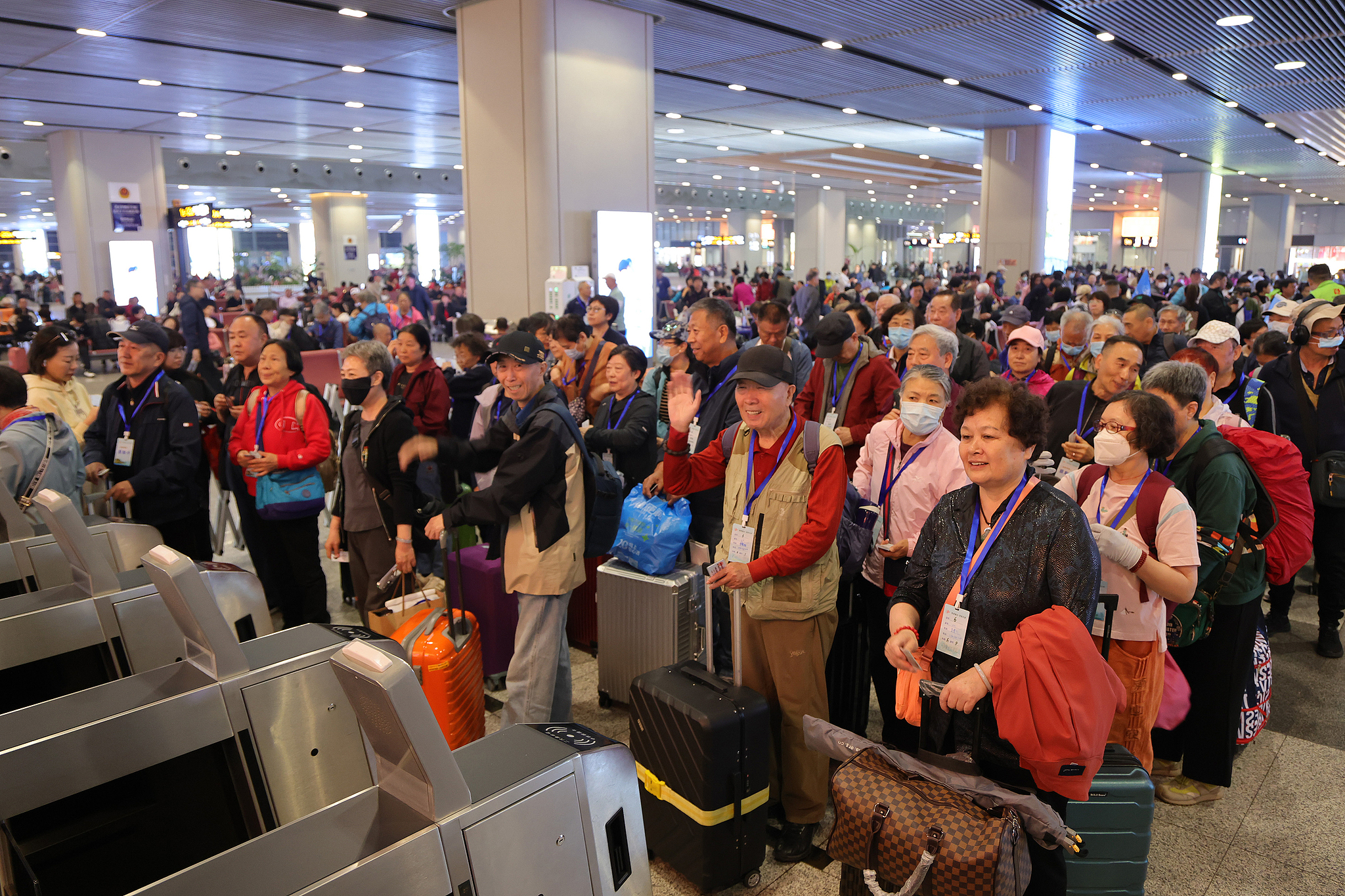 Passengers go through security checks and get ready to board trains at the Beijing Fengtai Railway Station, Beijing, China, April 16, 2025. / CFP