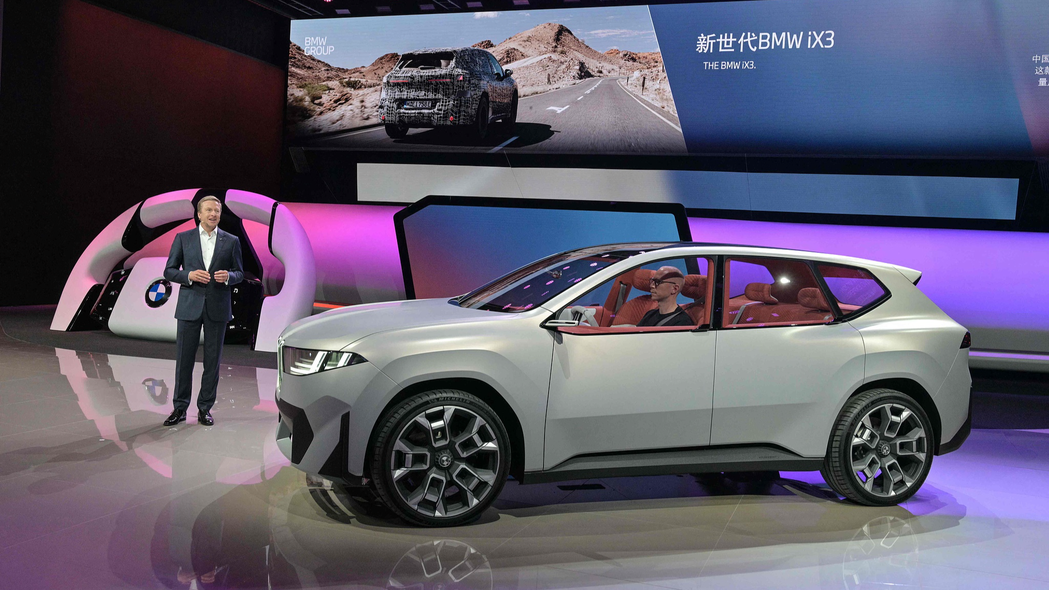BMW CEO Oliver Zipse speaks next to the new IX3 model during the 21st Shanghai International Automobile Industry Exhibition in Shanghai on April 23, 2025. /CFP