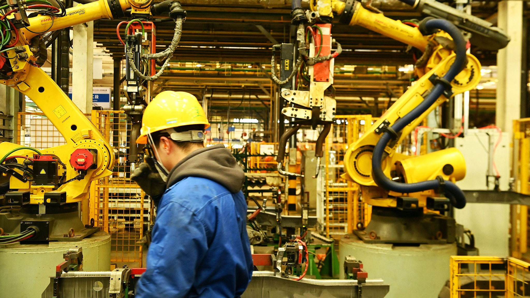 A worker conducting an inspection at Liuzhou Wuling Automobile Ind. Co. Ltd., in Qingdao, Shandong Province, April 24, 2025. /CFP