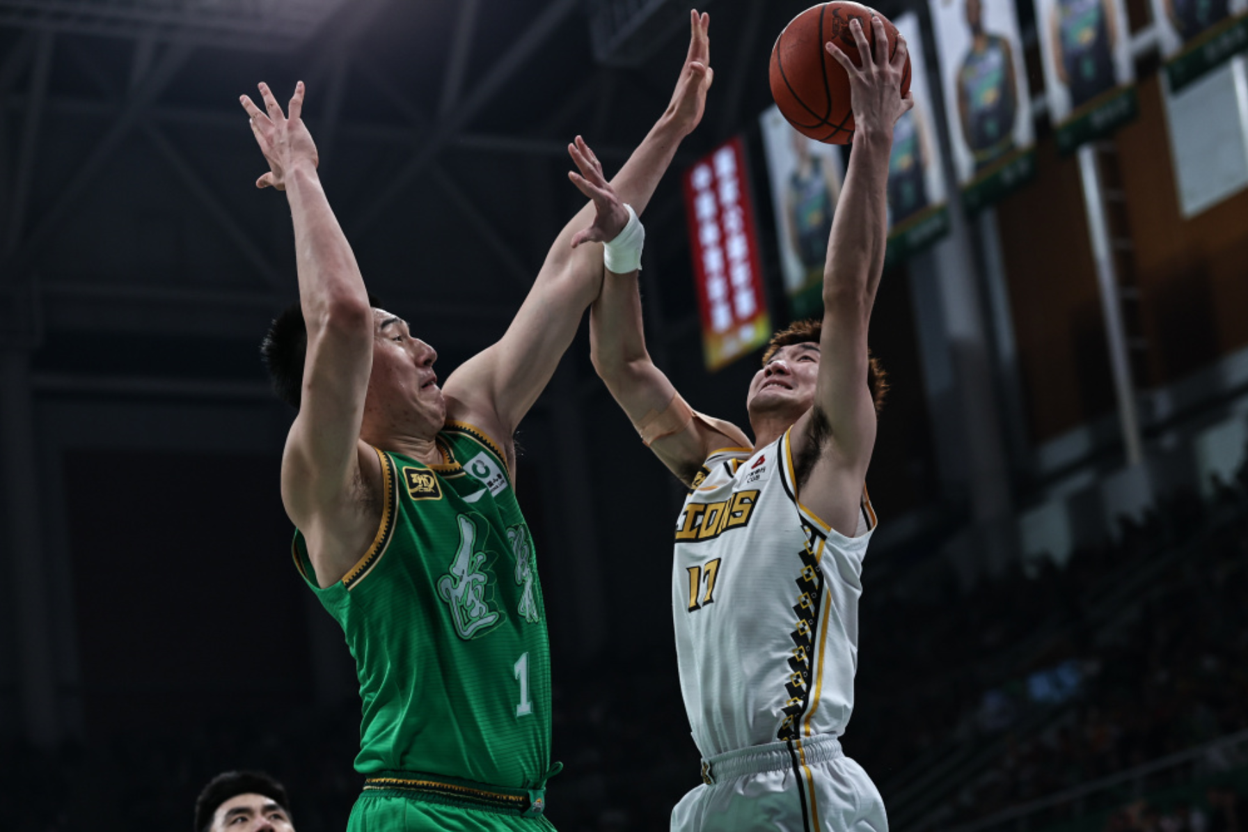 Sun Minghui (R) of the Guangsha Lions takes a shot against Fu Hao of the Liaoning Flying Leopards in Game 3 of their semifinal series in the Chinese Basketball Association (CBA) Playoffs in Shenyang, northeast China's Liaoning Province, May 1, 2025. /Xinhua
