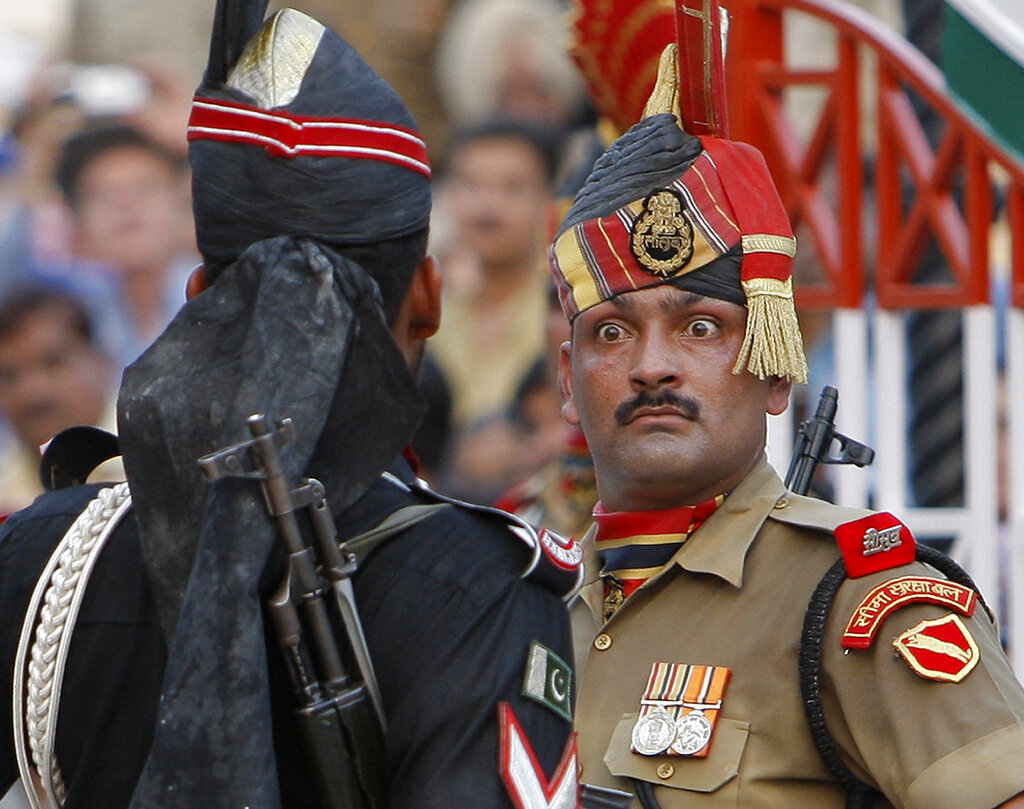 In this July 19, 2009 file photo, an Indian Border Security Force soldier, right, and a Pakistani Rangers soldier face one another at a daily closing ceremony at the Attari-Wagah border post. /Vincent Thian/AP